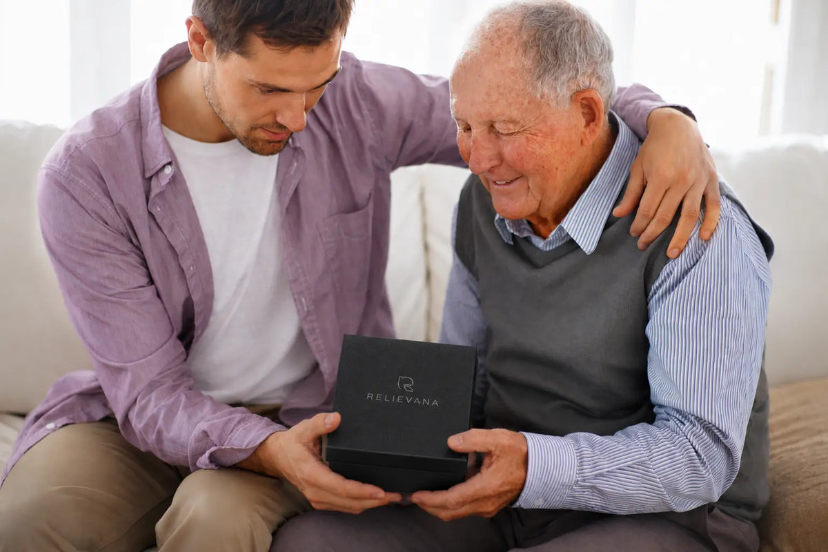 Adult son giving the Relievana Premium Nail Clipper Set as a gift to his father